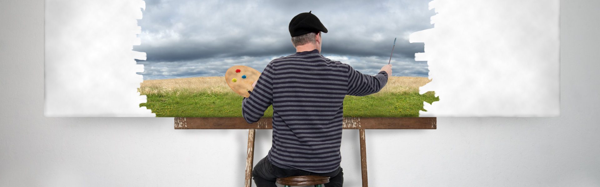 man painting in the wall